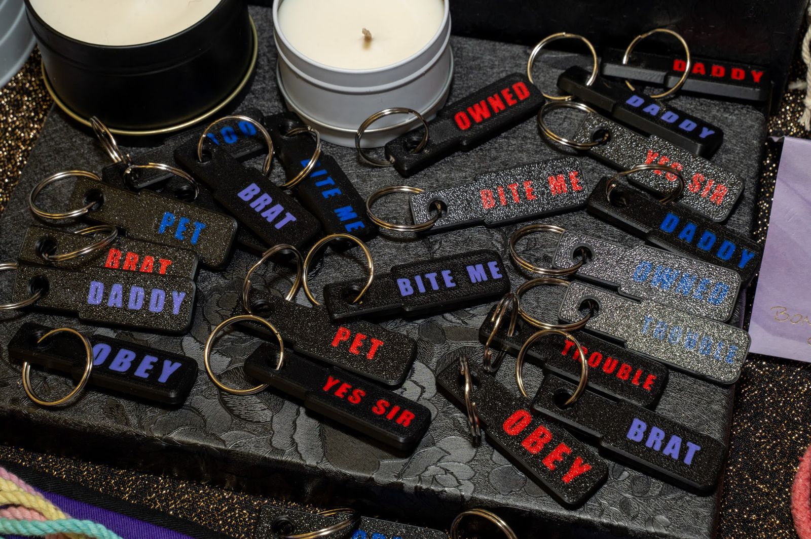 A rack of cheeky keyrings